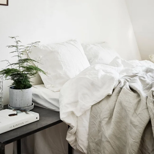 French flax linen sheets, prewashed and softened to sit gently against your skin – pictured made on a bed with white and natural coloured linen bed sheets - available at LOVINLIFE Co Byron Bay for all your gifts, candles and interior decorating needs