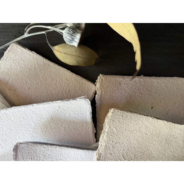 Flat lay close up of 2 x Bundles of Hand Pressed Paper A5 pages in white and natural with small flecks of grasses. Stocked at LOVINLIFE Co Byron Bay for all your gifts, candles and interior decorating needs 