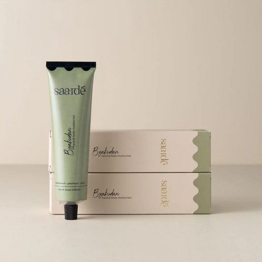 Hand & Body Moisturiser by Saarde - Byakudan - pictured with tube standing up next to two boxed tubes lying stacked on top of each other - Stocked at LOVINLIFE Co Byron Bay for all your gifts, candles and interior decorating needs