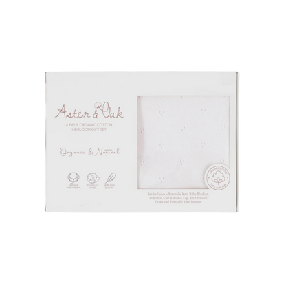 Aster & Oak organic cotton gift set packaging on a white background. The set  is an 100% organic cotton 4-piece Heirloom Knit Baby Gift Set in white with top, pants, bonnet and blanket. Set by Aster & Oak and Stocked at LOVINLIFE Co Byron Bay for all your gifts, candles and interior decorating needs