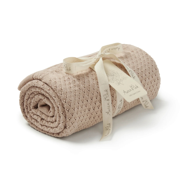 Rolled-up textured organic cotton Knit Heirloom Baby Blanket in Sand with a ribbon on a white background. Stocked at LOVINLIFE Co Byron Bay for all your gifts, candles and interior decorating needs
