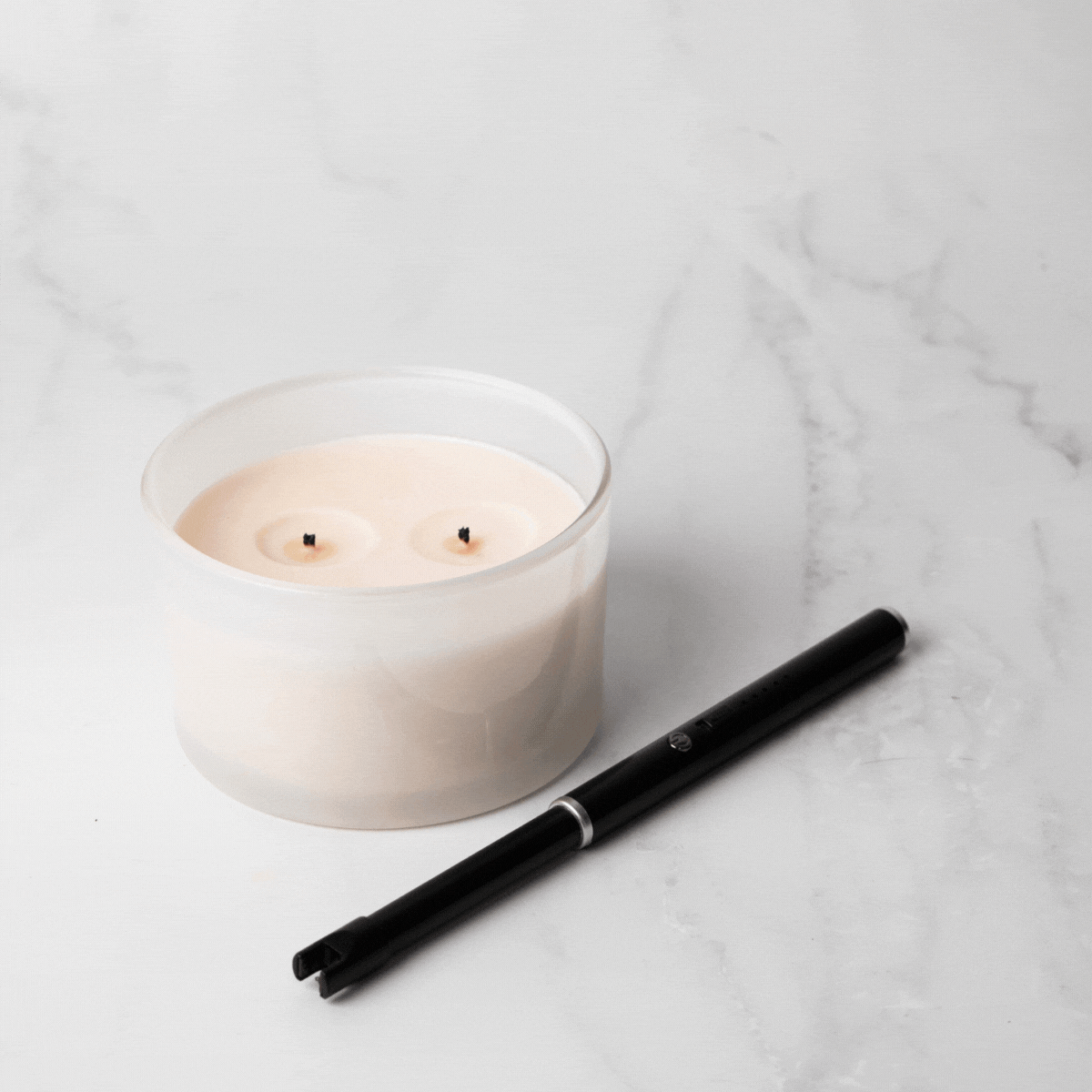 USB Rechargeable Candle and Incense Lighter - Black Lighter pictured lighting twin wick candle - Stocked at LOVINLIFE Co Byron Bay for all your gifts, candles and interior decorating needs