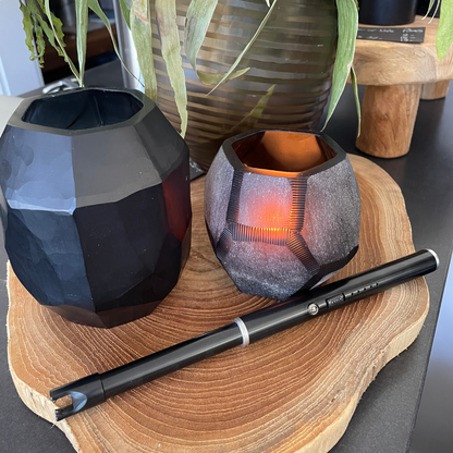 USB Rechargeable Candle and Incense Lighter - Black Lighter pictured on wooden board with black glass lanterns - Stocked at LOVINLIFE Co Byron Bay for all your gifts, candles and interior decorating needs