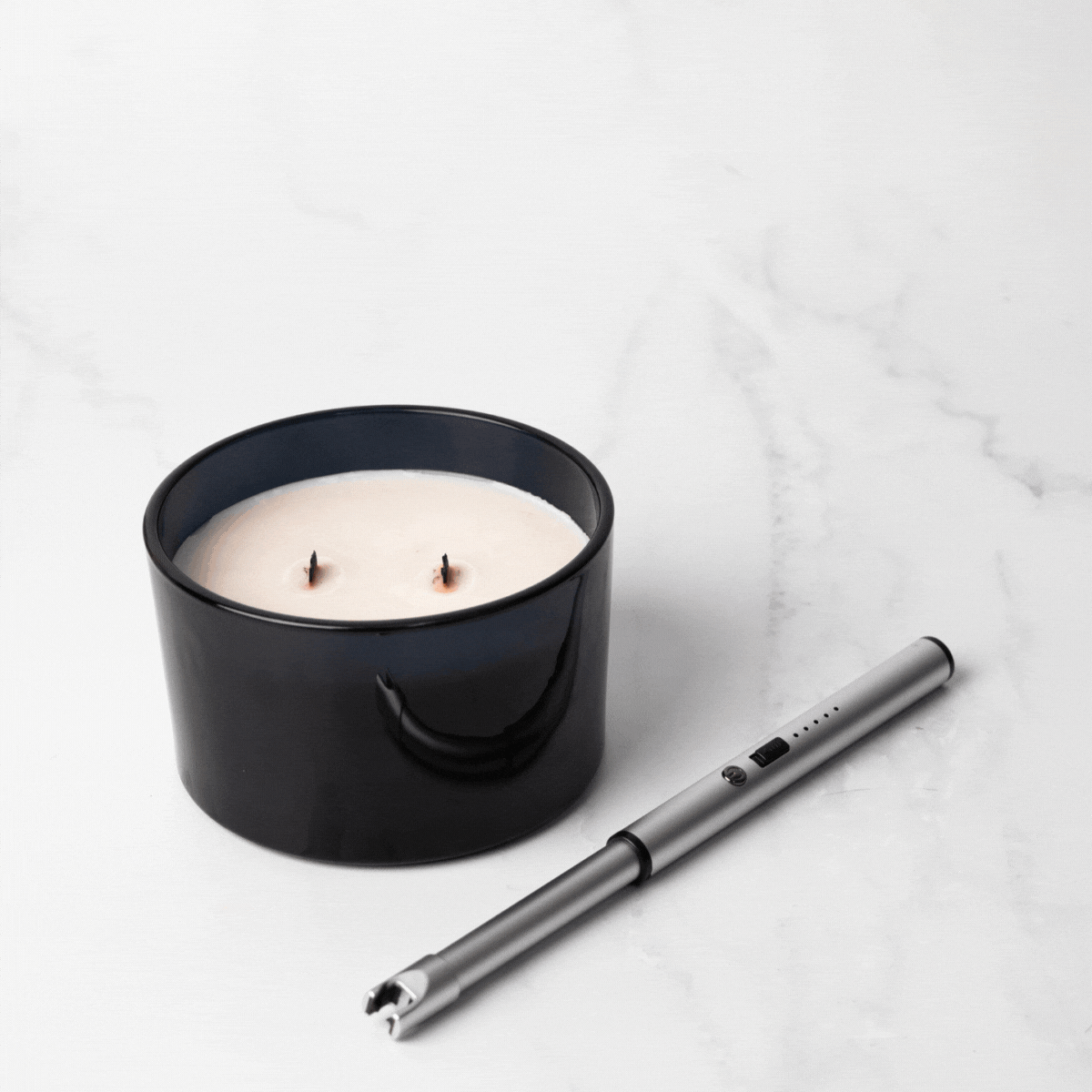 USB Rechargeable Candle and Incense Lighter - Silver laser Lighter pictured lighting twin wick candle - Stocked at LOVINLIFE Co Byron Bay for all your gifts, candles, homewares and interior decorating needs