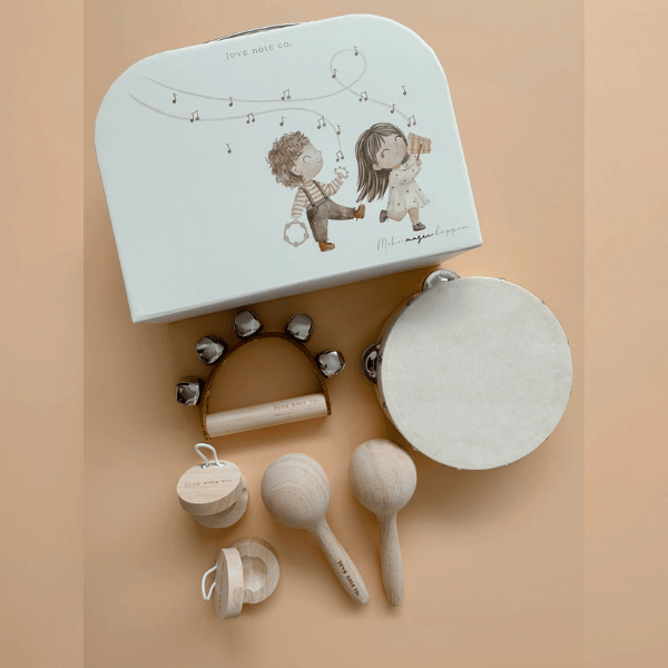 Little Love Music Set for children. Set includes: Maracas (x2) Castanets (x2) Tambourine Drum (x1) Hand bells (x1)  Suitcase (x1). Comes with a beautiful in house designed suitcase to pack up and store the instruments in. Made with Wood, iron and leather. All  instruments by Love Note Co are handmade items, non-toxic, eco-friendly and sustainably sourced. Stocked at LOVINLIFE Co Byron Bay for all your gifts, candles and interior decorating needs