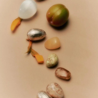 Loco Love Cosmic Eggs - Coconut Dream on a cream benchtop with fruit and gem stones scattered. Available at LOVINLIFE Co Byron bay