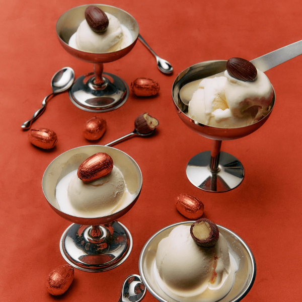 Ice cream with Loco Love Cosmic Egg - Salted Caramel in metal bowls on a red background. Available at LOVINLIFE Co Byron bay