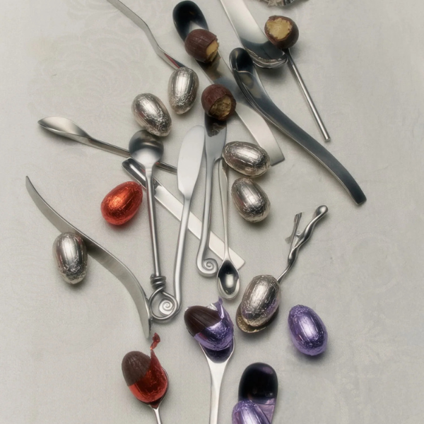 Silver spoons with colourful Loco Love Cosmic Egg - Salted Caramel on a light grey background. Available at LOVINLIFE Co Byron Bay
