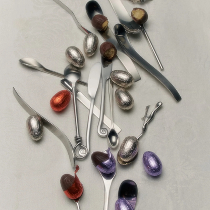 Silver spoons with colourful Loco Love Cosmic Egg - Salted Caramel on a light grey background. Available at LOVINLIFE Co Byron Bay