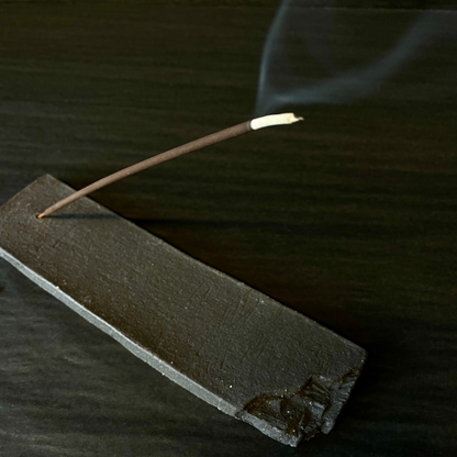 Lovinlife Co ByronBay - Handmade Signature Ceramics Range - Dark Matter Slab Series, matt black stone finish clay pieces - Incense Holder - Long Slab holding a smoking incense stick - available at LOVINLIFE Co Byron Bay for all your gifts, candles and interior decorating needs