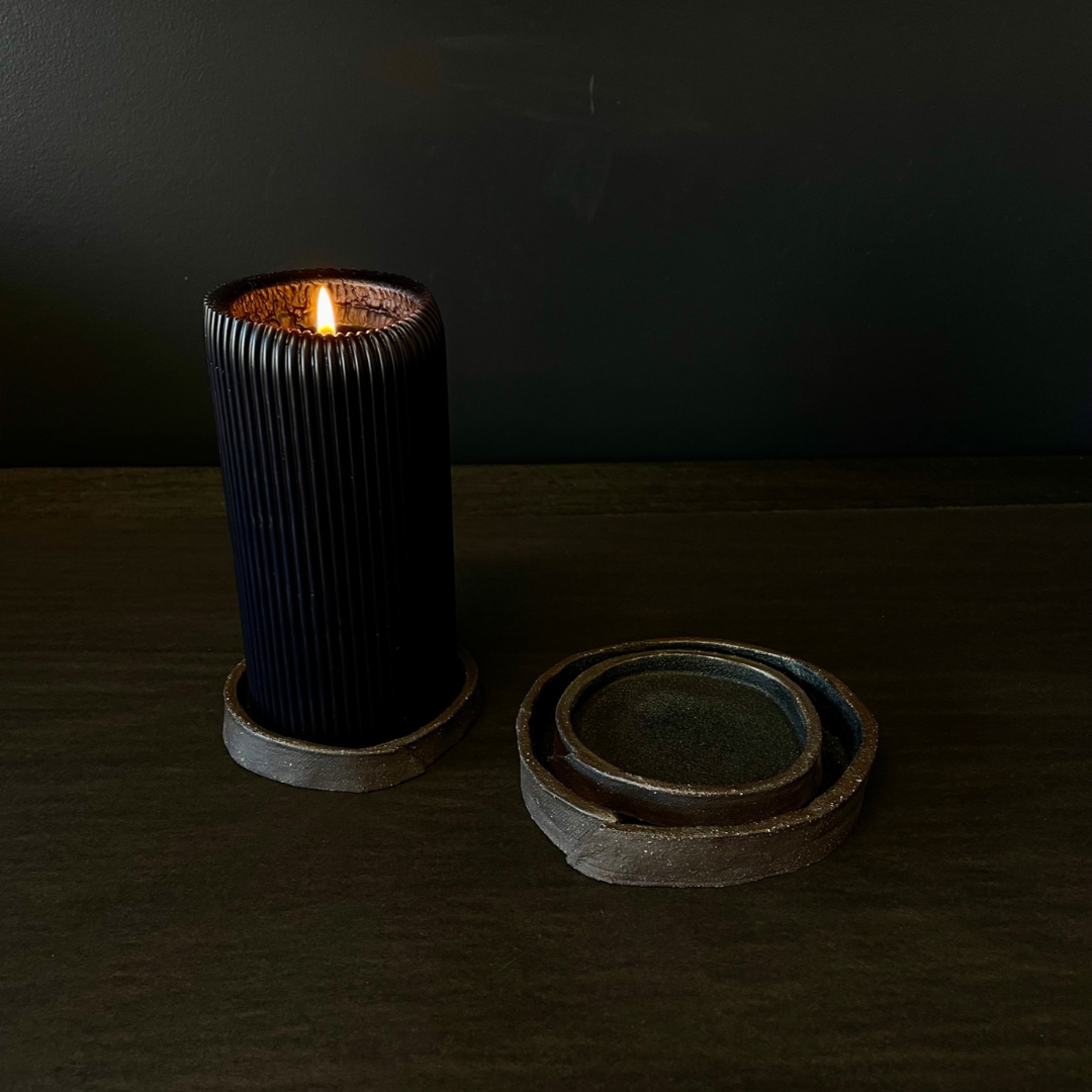 Lovinlife Co ByronBay - Handmade Signature Ceramics Range - Dark Matter Slab Series, matt black stone finish clay pieces - Slab Fold Smudging bowl / dishes x 3, pictured with one holding buring ribbed black pillar candle and the other two stacked - available at LOVINLIFE Co Byron Bay for all your gifts, candles and interior decorating needs