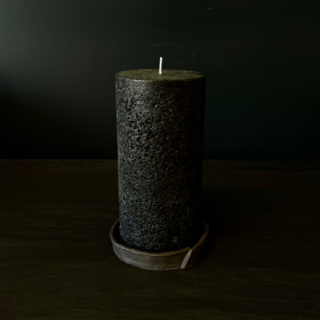 Lovinlife Co ByronBay - Handmade Signature Ceramics Range - Dark Matter Slab Series, matt black stone finish clay pieces - Slab Fold Smudging bowl / dish, pictured holding textured black pillar candle - available at LOVINLIFE Co Byron Bay for all your gifts, candles and interior decorating needs