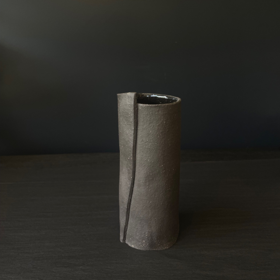 Lovinlife Co ByronBay - Handmade Signature Ceramics Range - Dark Matter Slab Series, matt black stone finish clay pieces - Slab Fold Vase 4 pictured on black background - available at LOVINLIFE Co Byron Bay for all your gifts, candles and interior decorating needs