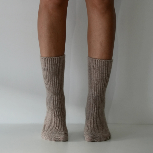 Taupe coloured socks on a person’s feet, front view, on a plain background. Luxe Cashmere Blend Socks by Number Thirty One made with a premium blend of cashmere and wool. Unisex & One size. Stocked at LOVINLIFE Co Byron Bay for all your gifts, candles and interior decorating needs