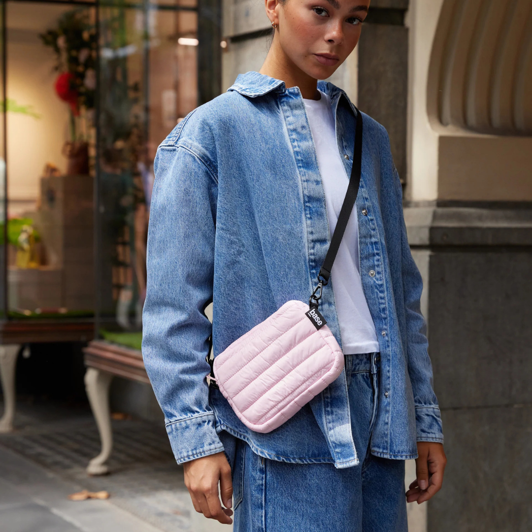 Mini Base Cloud Bag - a small crossbody bag in soft, cloud-like fabric - peony bag pictured being worn across the torso - Stocked at LOVINLIFE Co Byron Bay for all your gifts, candles and interior decorating needs