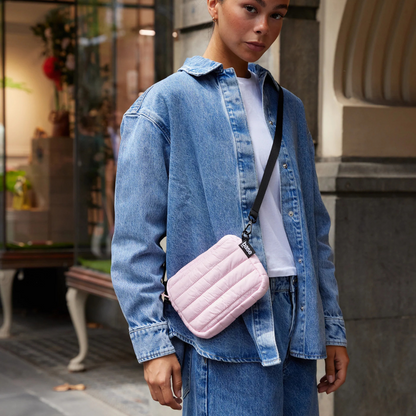 Mini Base Cloud Bag - a small crossbody bag in soft, cloud-like fabric - peony bag pictured being worn across the torso - Stocked at LOVINLIFE Co Byron Bay for all your gifts, candles and interior decorating needs