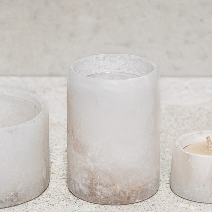 Alabaster Votive Candles by Natures Atelier - medium size pictured on a natural coloured bench - Stocked at LOVINLIFE Co Byron Bay for all your gifts, candles and interior decorating needs