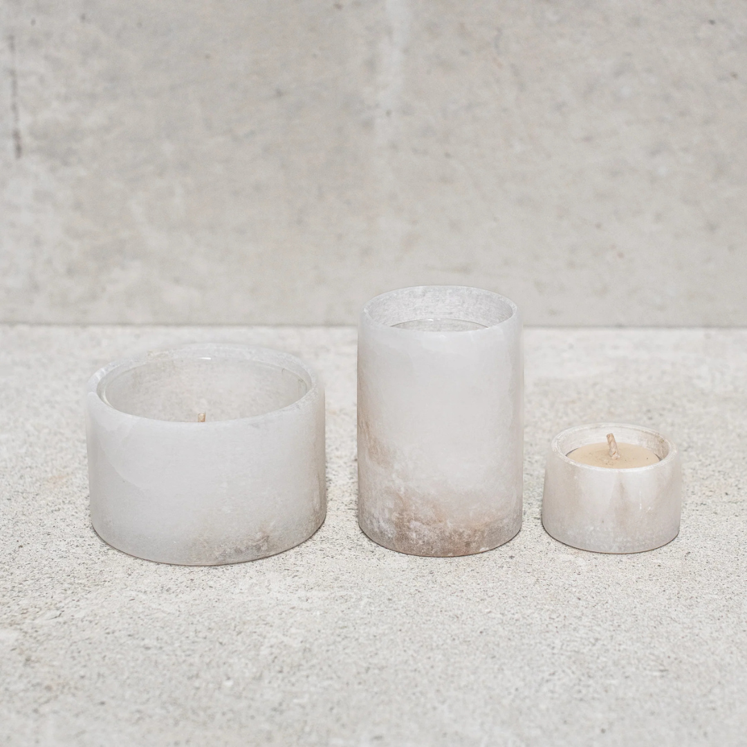 Alabaster Votive Candles by Natures Atelier - all 3 sizes pictured on a natural coloured bench standing next to each other - Stocked at LOVINLIFE Co Byron Bay for all your gifts, candles and interior decorating needs