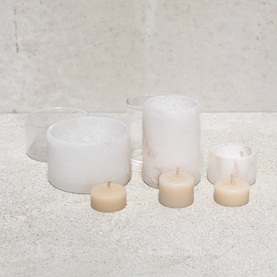 Alabaster Votive Candles by Natures Atelier - all 3 sizes shown with the beeswax candle standing in front of the Alabaster exterior, and the clear glass interior of the large and medium sizes standing behind - Stocked at LOVINLIFE Co Byron Bay for all your gifts, candles and interior decorating needs