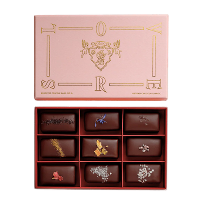 Flat lay of open chocolate box with 9 x Loco Love Chocolates inside. Available at LOVINLIFE Co Byron Bay