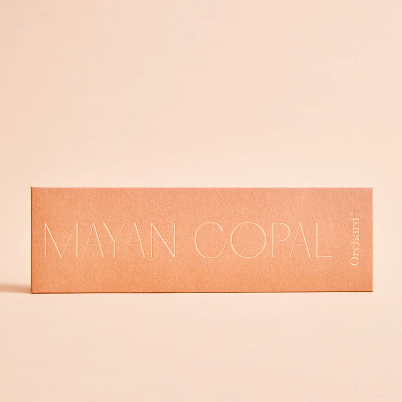 Orchard – Incense Natural Myan Copal. A pack of twelve sacred incense sticks pictured with the words “Myan Copal” on the front. Each stick is made entirely by hand, purely from plants and completely free of synthetic oils and fragrances - Stocked at LOVINLIFE Co Byron Bay for all your gifts, candles, homewares and interior decorating needs