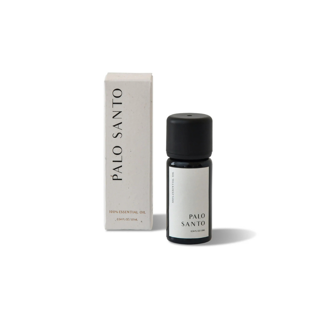 Essential Oil Palo Santo - A 100% pure essential oil blend, free from gluten, cruelty, parabens, and phthalates - bottle pictured standing next to box - Stocked at LOVINLIFE Co Byron Bay for all your gifts, candles and interior decorating needs