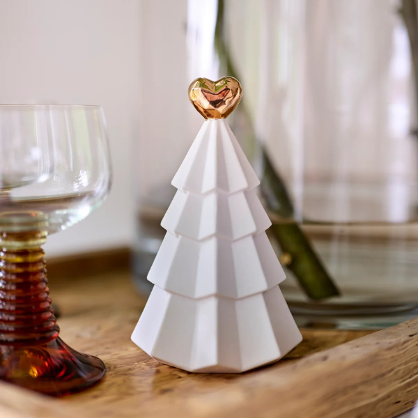 White ceramic Christmas tree with a gold heart on top, placed on a wooden surface. Part of the Robert Gordon Collection stocked at LOVINLIFE Co Byron Bay for all your gifts, candles, homewares and interior decorating needs