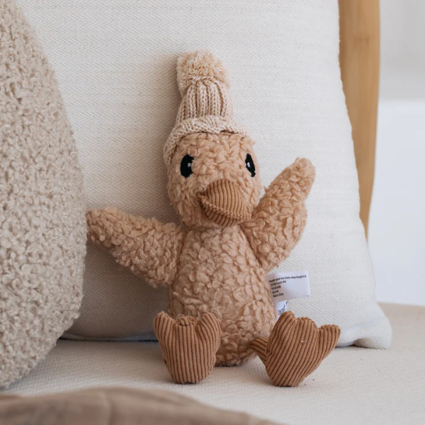 Soft Toy Duck sitting on a couch made from a unique cotton plush fabric with caramel corduroy accents and Australian merino wool knitted beanie - Duck Edmond - Available at LOVINLIFE Co Byron Bay