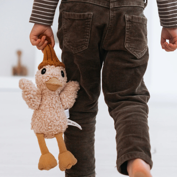 Girl hugging his Soft Toy Duck made from a unique cotton plush fabric with caramel corduroy accents and Australian merino wool knitted beanie - Duck Petunia - Available at LOVINLIFE Co Byron Bay