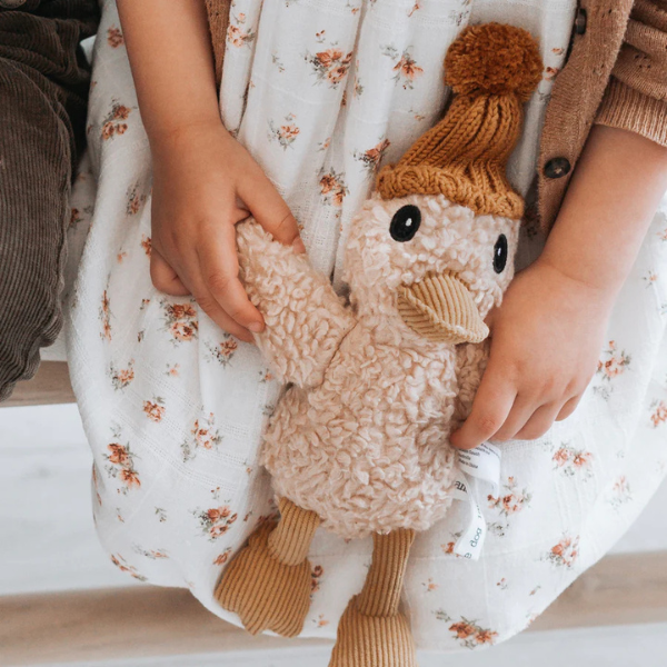 Child holding a Soft Toy Duck made from a unique cotton plush fabric with caramel corduroy accents and Australian merino wool knitted beanie - Duck Petunia - Available at LOVINLIFE Co Byron Bay