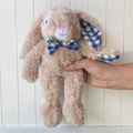 Hand holding a Soft Toy Rabbit made from a unique Vanilla cotton plush fabric with dapper blue gingham bow tie - Rabbit Louis - Available at LOVINLIFE Co Byron Bay