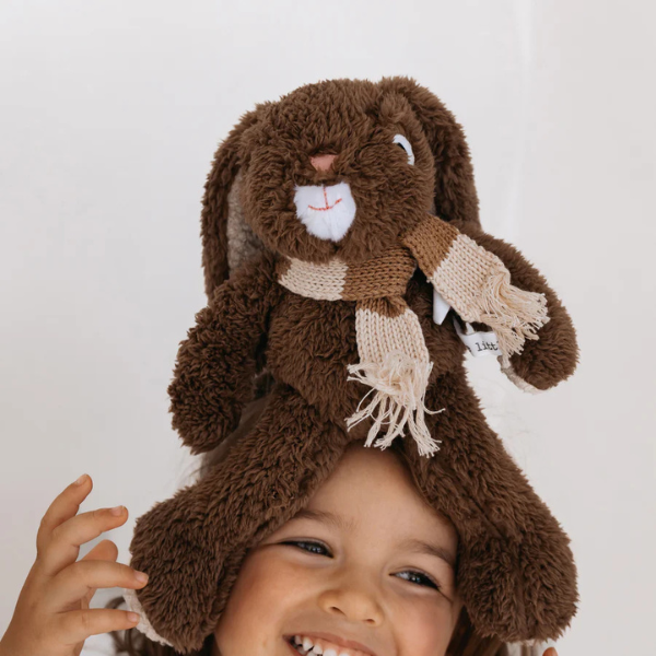 Child wearing a Soft Toy Rabbit made from a unique Chocolate Brown cotton plush fabric with an Australian merino wool knitted scarf - Rabbit Frankie - Available at LOVINLIFE Co Byron Bay