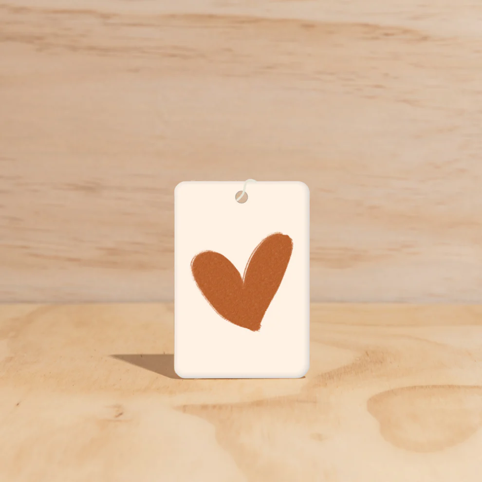 Warm Heart design Air Freshener tags - Made from 100% post-consumer materials - Ubud scent Elevate your spiritual side with the woodiness of Agarwood, and dreaminess of Musk and Patchouli, then be taken to the tranquil terraces of the Ubud hinterland - Stocked at LOVINLIFE Co Byron Bay for all your gifts, candles and interior decorating needs