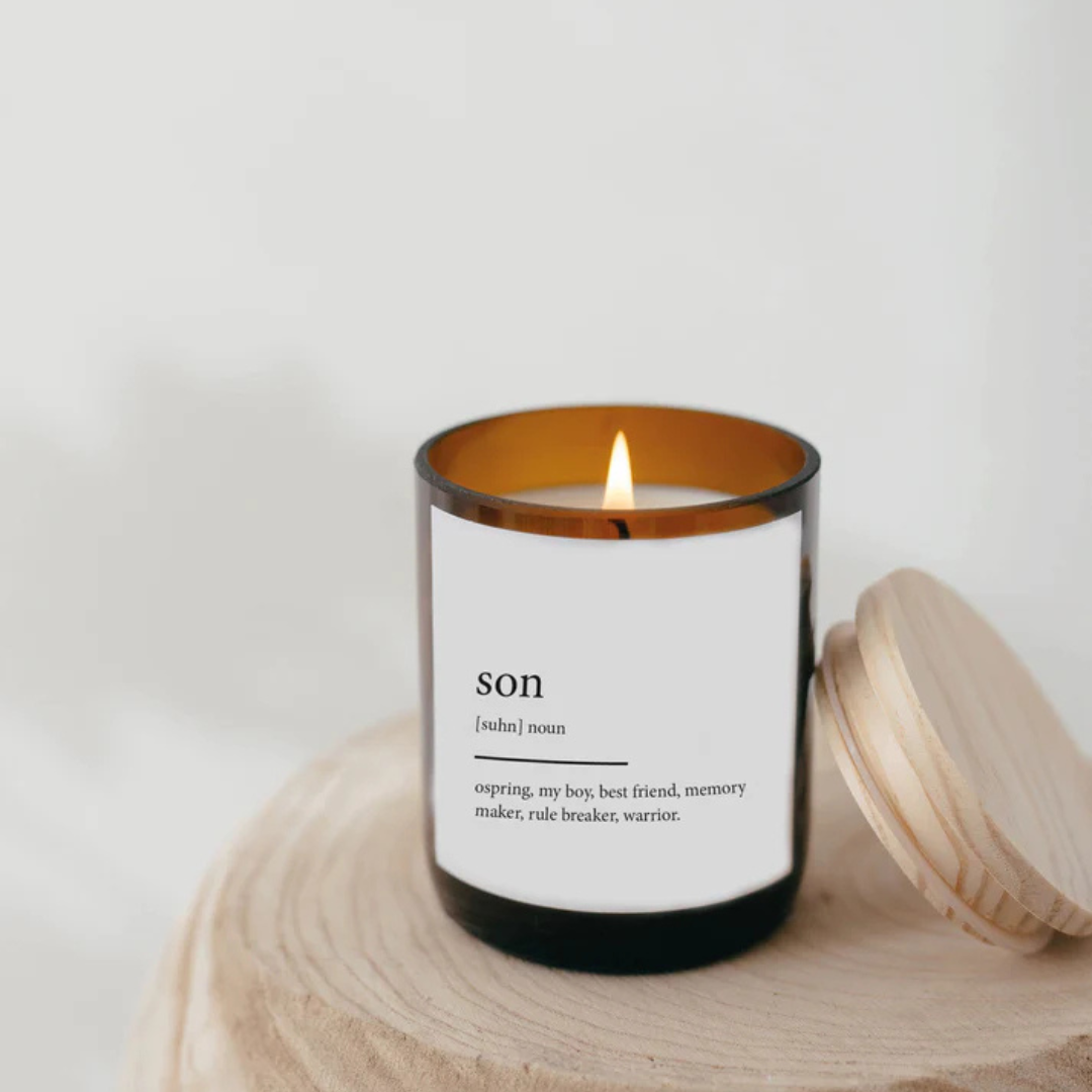 Commonfolk Dictionary Meaning Candle Range - Son - India scent with teakwood + tobacco - jar pictured with lid resting on the side of the jar on top of a wood board or table - Stocked at LOVINLIFE Co Byron Bay for all your gifts, candles and interior decorating needs