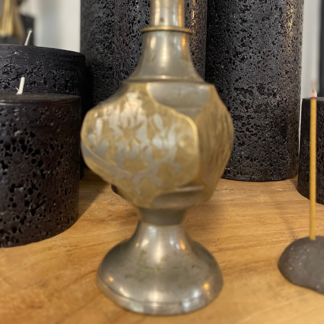 Vintage Indian Perfume Bottle, close up of irregular shape face bottle, next to smoking incense stick on display at LOVINLIFE Co Byron Bay for all your gifts, candles and interior decorating needs