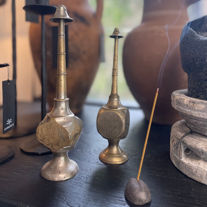 Vintage Indian Perfume Bottles, next to smoking incense stick - on display at LOVINLIFE Co Byron Bay for all your gifts, candles and interior decorating needs