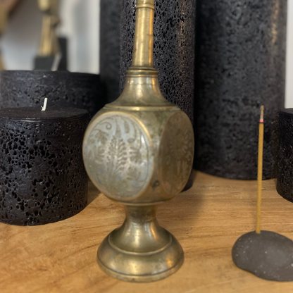 Vintage Indian Perfume Bottle, close up of round face bottle, next to smoking incense stick on display at LOVINLIFE Co Byron Bay for all your gifts, candles and interior decorating needs