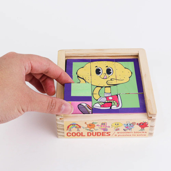 Wooden puzzle with cartoon character and 'Cool Dudes' branding on a white background. From Wooden Block Puzzle - Cool Dudes - Stocked at LOVINLIFE Co Byron Bay for all your gifts, candles, homewares and interior decorating needs