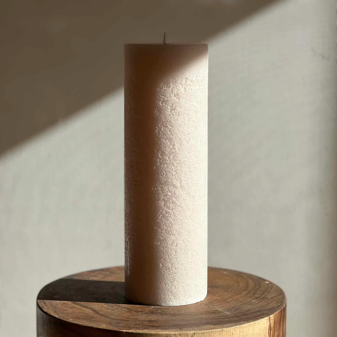 Candle Kiosk - Textured Sandstone Pillar Candles - large candle on wood stool - Stocked at LOVINLIFE Co Byron Bay for all your gifts, candles and interior decorating needs