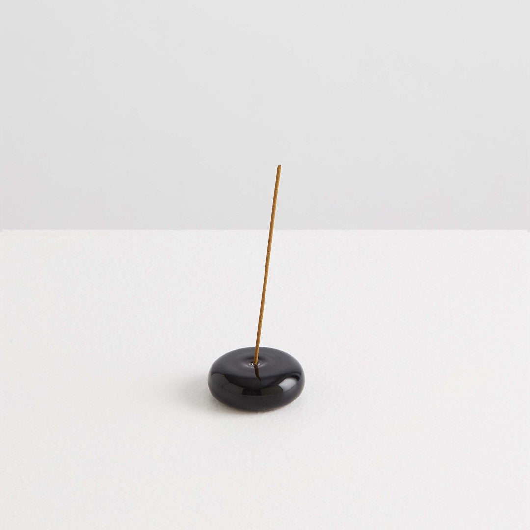 Maison Balzac Le Galet, or the pebble, is a playful and minimal bubble of 100% Borosilicate glass hand blown into a modern incense stick holder - black glass pebbles with incense stick - Stocked at LOVINLIFE Co Byron Bay for all your gifts, candles and interior decorating needs