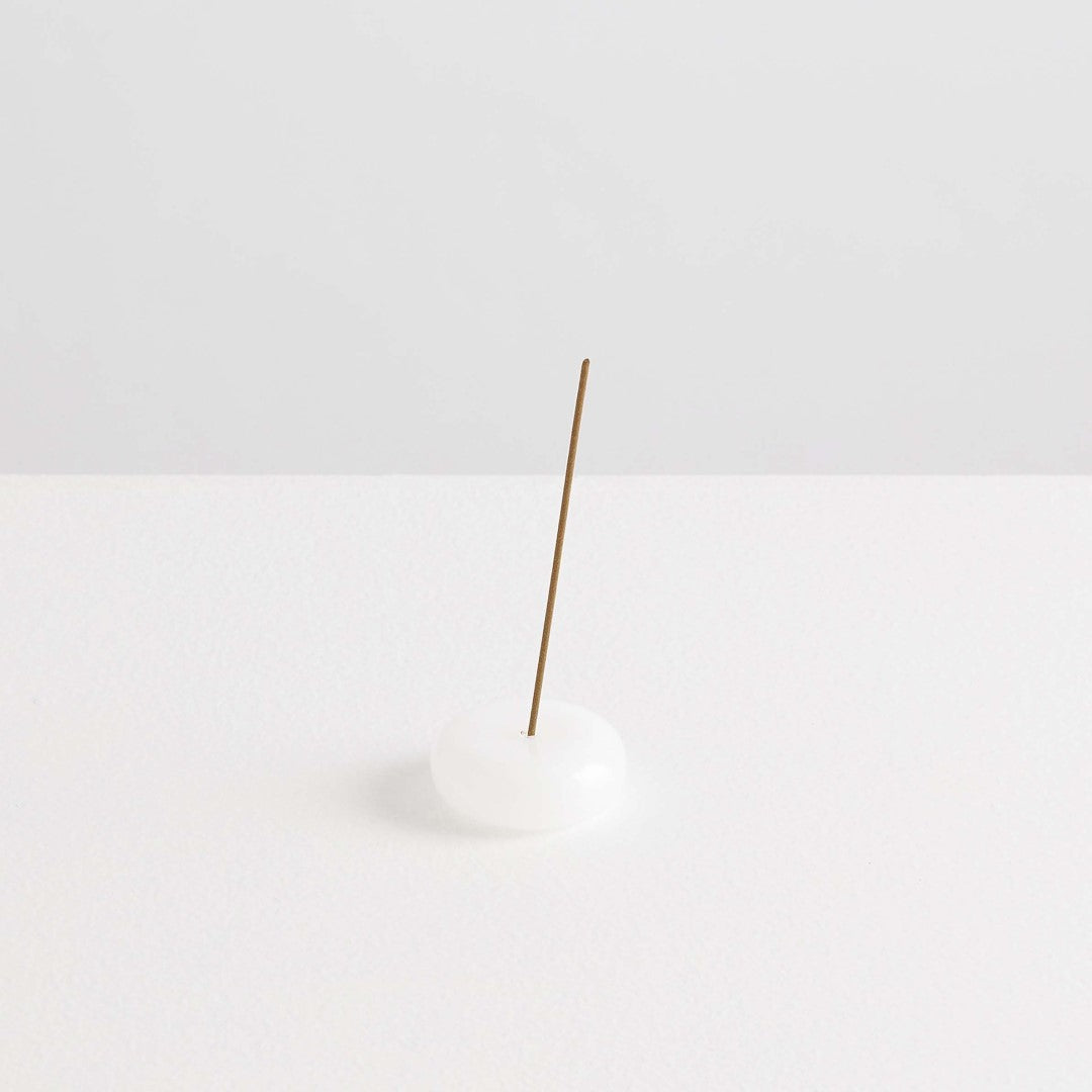 Maison Balzac Le Galet, or the pebble, is a playful and minimal bubble of 100% Borosilicate glass hand blown into a modern incense stick holder - white glass pebbles with incense stick - Stocked at LOVINLIFE Co Byron Bay for all your gifts, candles and interior decorating needs