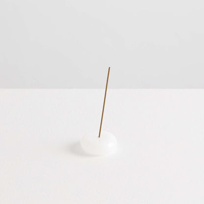 Maison Balzac Le Galet, or the pebble, is a playful and minimal bubble of 100% Borosilicate glass hand blown into a modern incense stick holder - white glass pebbles with incense stick - Stocked at LOVINLIFE Co Byron Bay for all your gifts, candles and interior decorating needs
